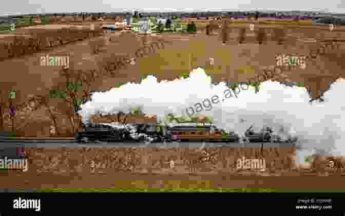 A Vintage Locomotive Steaming Down A Track, Surrounded By Lush Greenery Rails To Penn State: The Story Of The Bellefonte Central