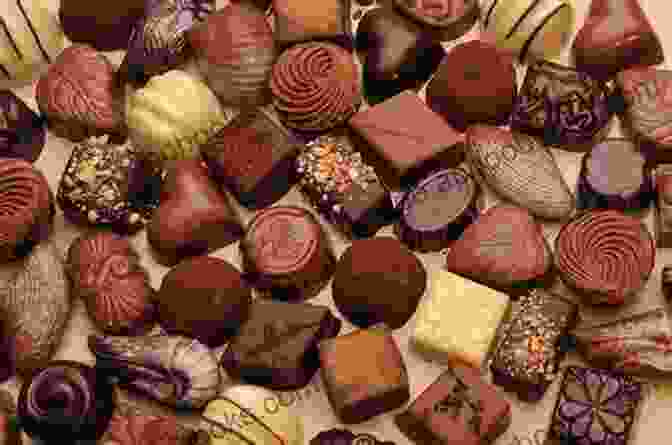 An Assortment Of Exquisite Chocolates, Truffles, Bonbons, And Bars, Arranged In A Decadent Display Of Flavors And Textures. Divas Of The Deepest Chocolate